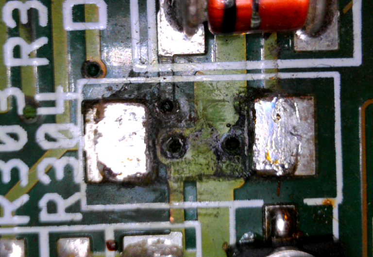 Capacitor leakage look under surrounding components I am TSB